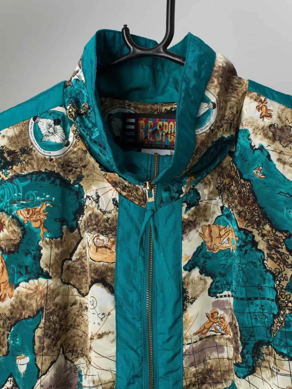 Vintage shell jacket with maps and cherubs in teal blue – Medium